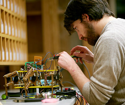 A computer science student builds a robot