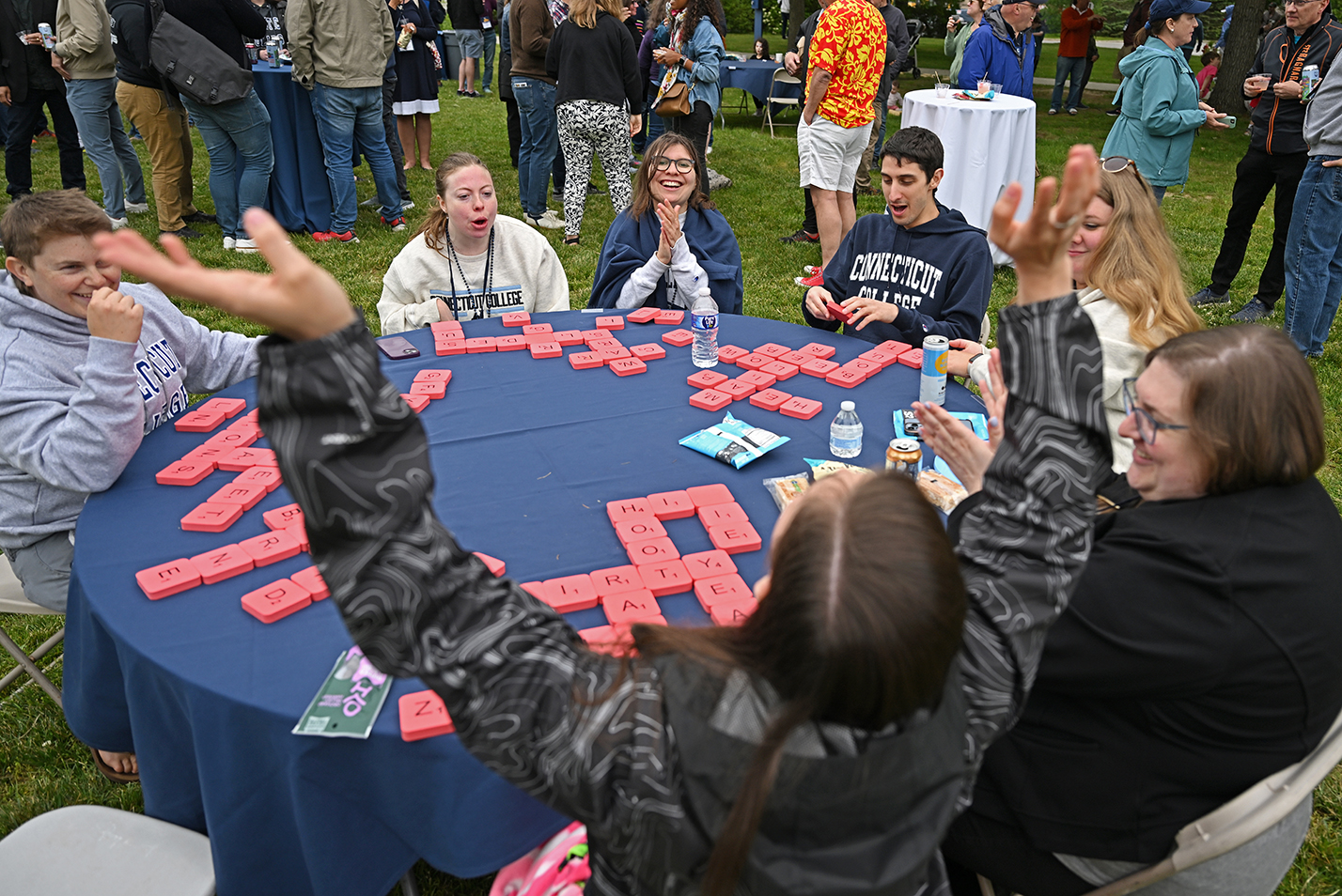 Alumni at 2023 Reunion Playing Large Board Game