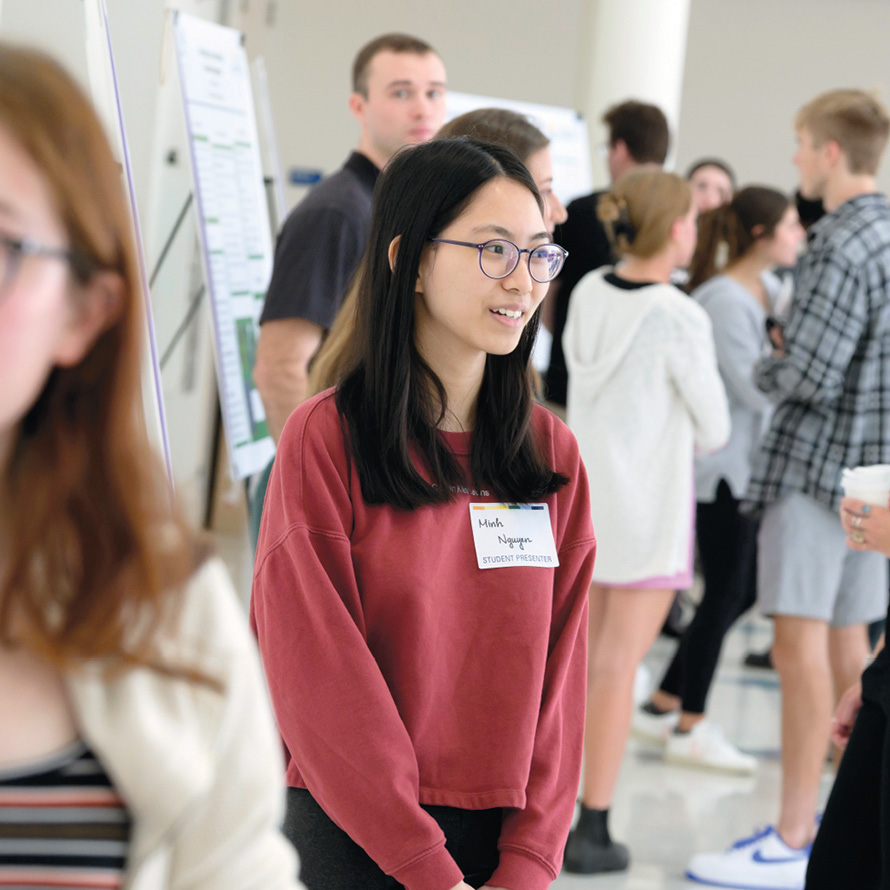 Image of students presenting at the All-College Symposium