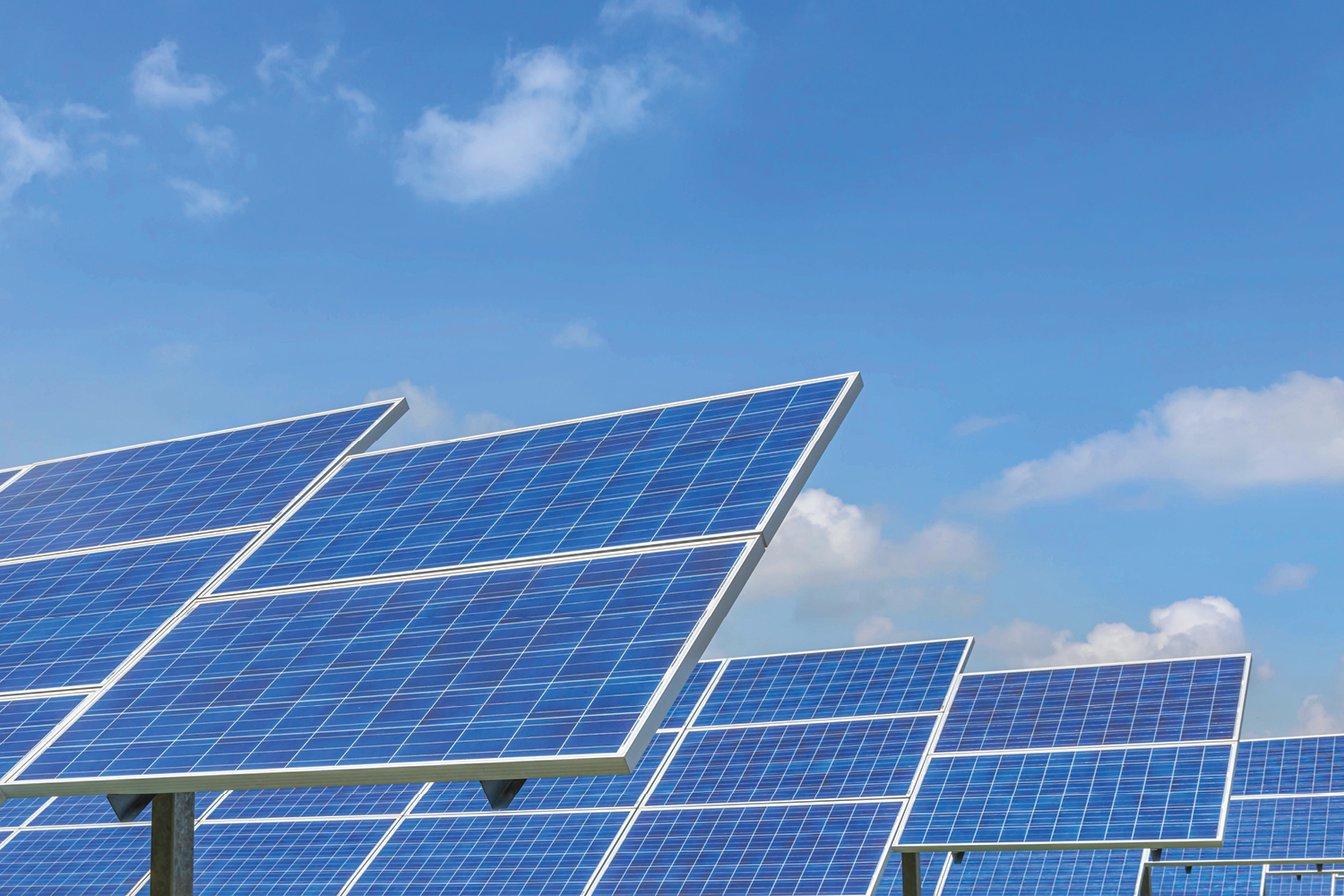 An image of solar panels under a blue sky