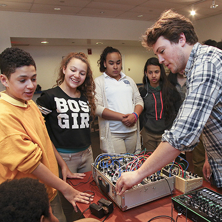 Ned Rogers '16 leads a music technology workshop on the Connecticut College campus for students from Bennie Dover Jackson Middle School in New London, Connecticut. 