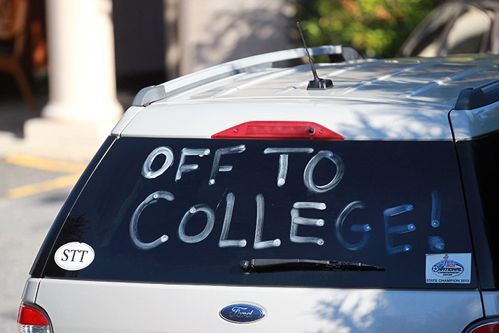 A car with Off to College written in the window