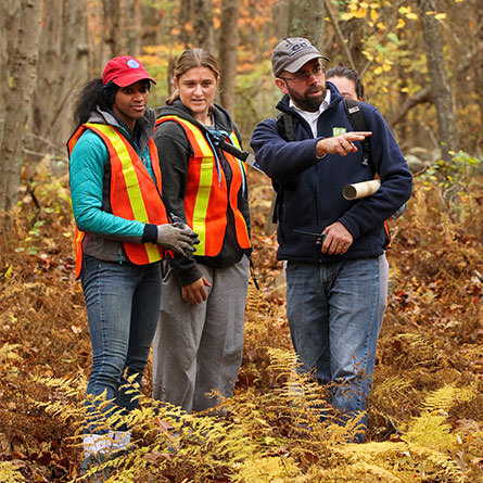 Associate Professor of Anthropology, Anthony Graesch teaches a class in the college's arboretum.