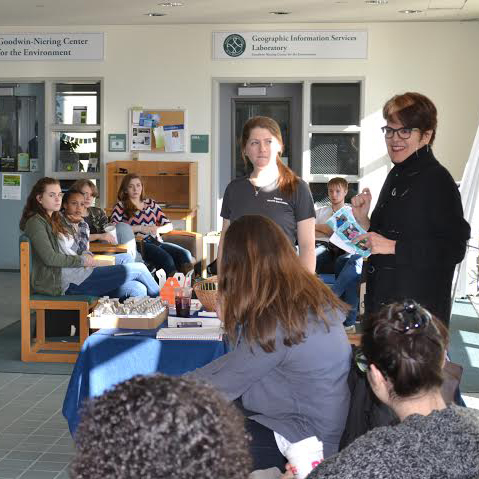President Katherine Bergeron (right, standing) greeted a group of local high school students during the recent 