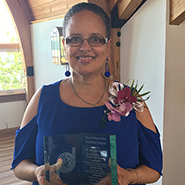 Professor Michelle Dunlap poses with her award