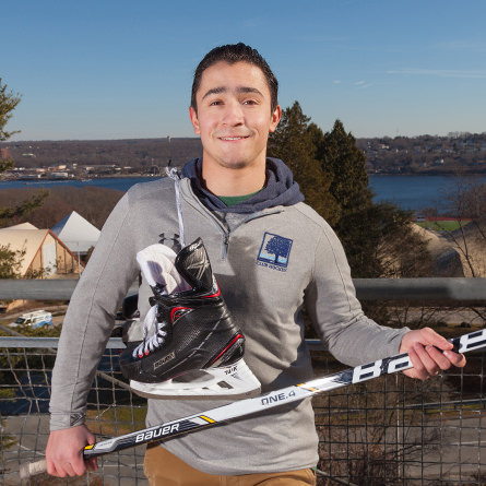 Cameron Segal ’20 introduces hockey to New London's newly-arrived middle schoolers.