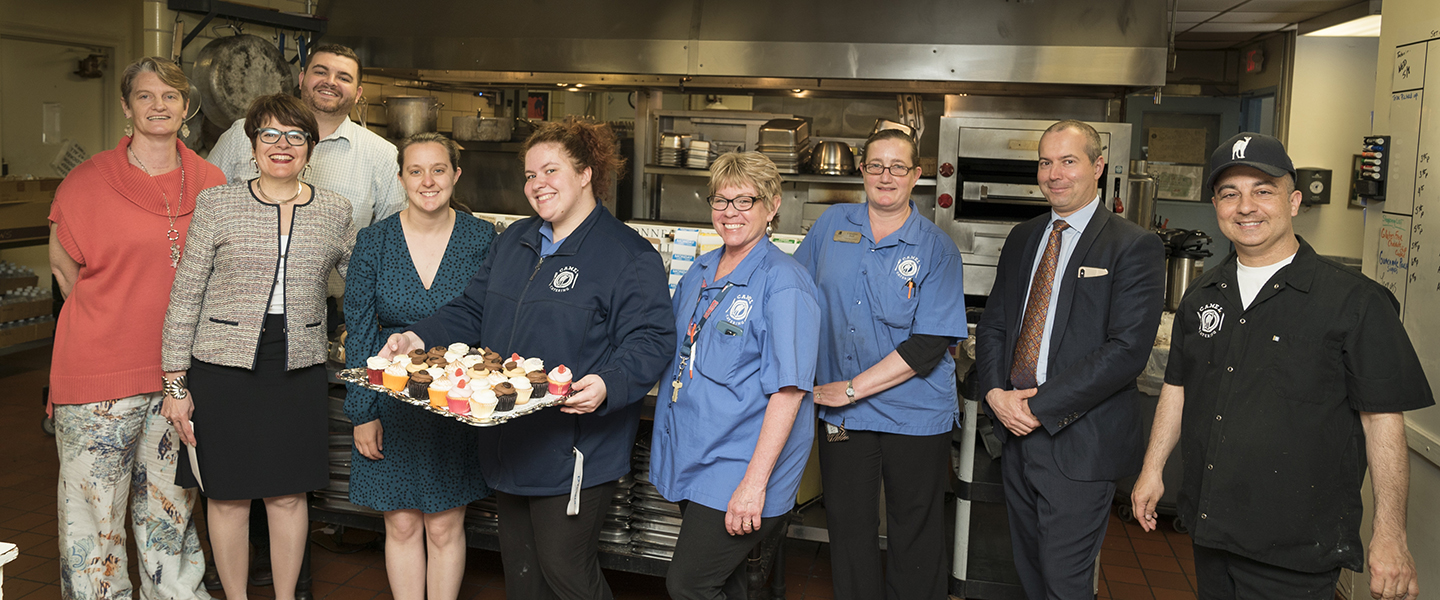 Members of the Catering Team pose with President Bergeron and others. 