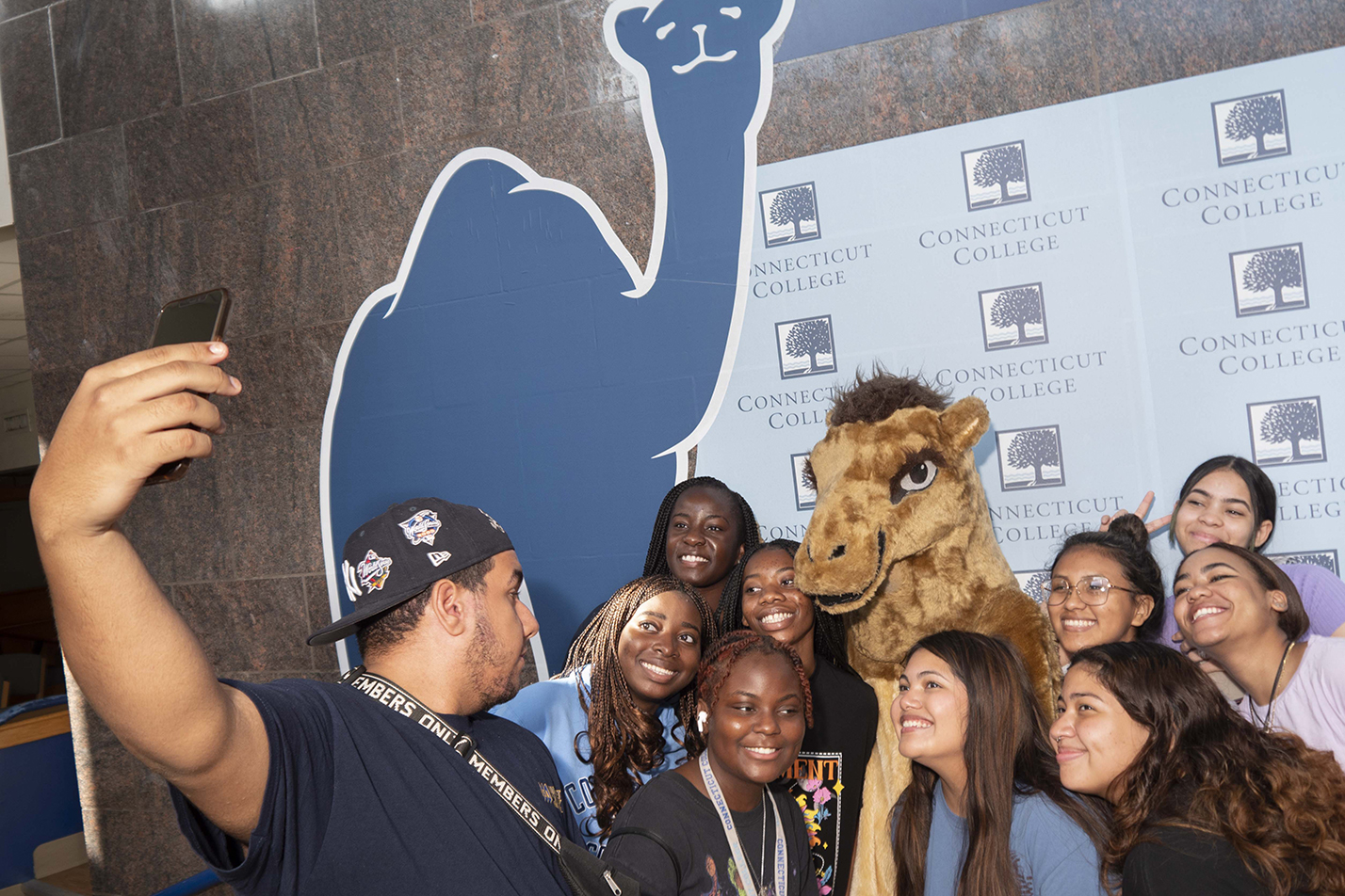 Students pose for a selfie with the Camel mascot
