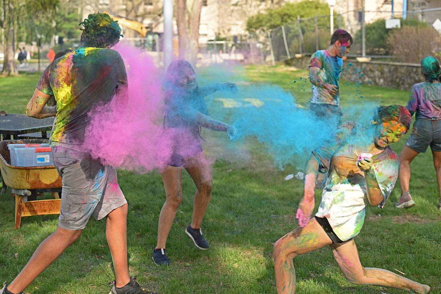 Students playing at a celebration of Holi, the Hindu festival of colors Friday, April 14, 2023.