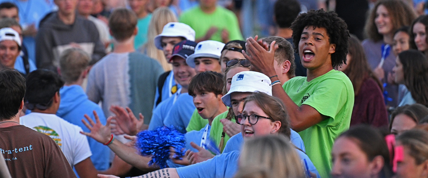 Students cheer as new students process during the New Student Walk on Arrival Day.