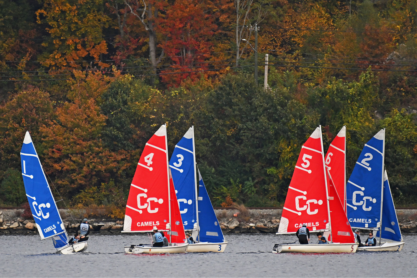 Colorful Conn sailboats on the Thames River in Fall.
