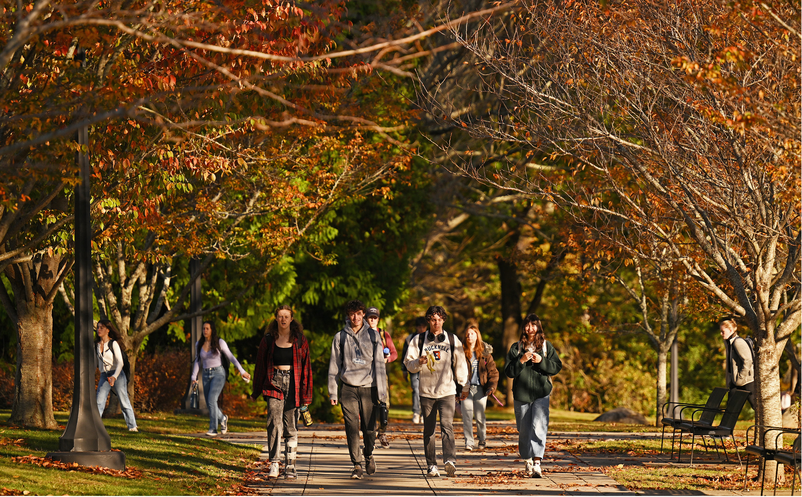 Students walking on campus in Fall.