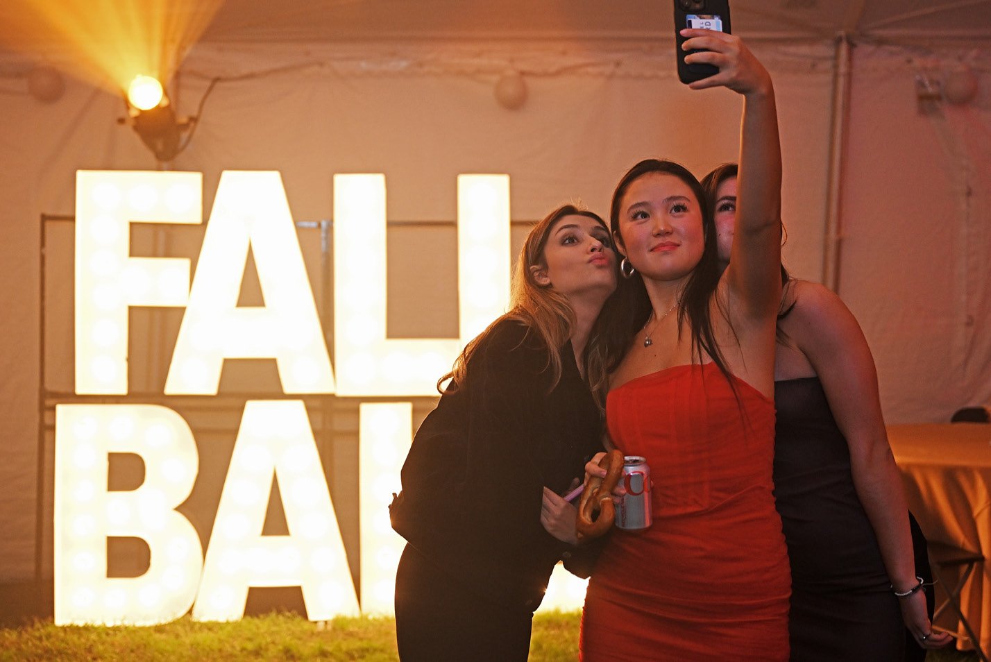 Students pose for a selfie at the 2023 Fall Ball