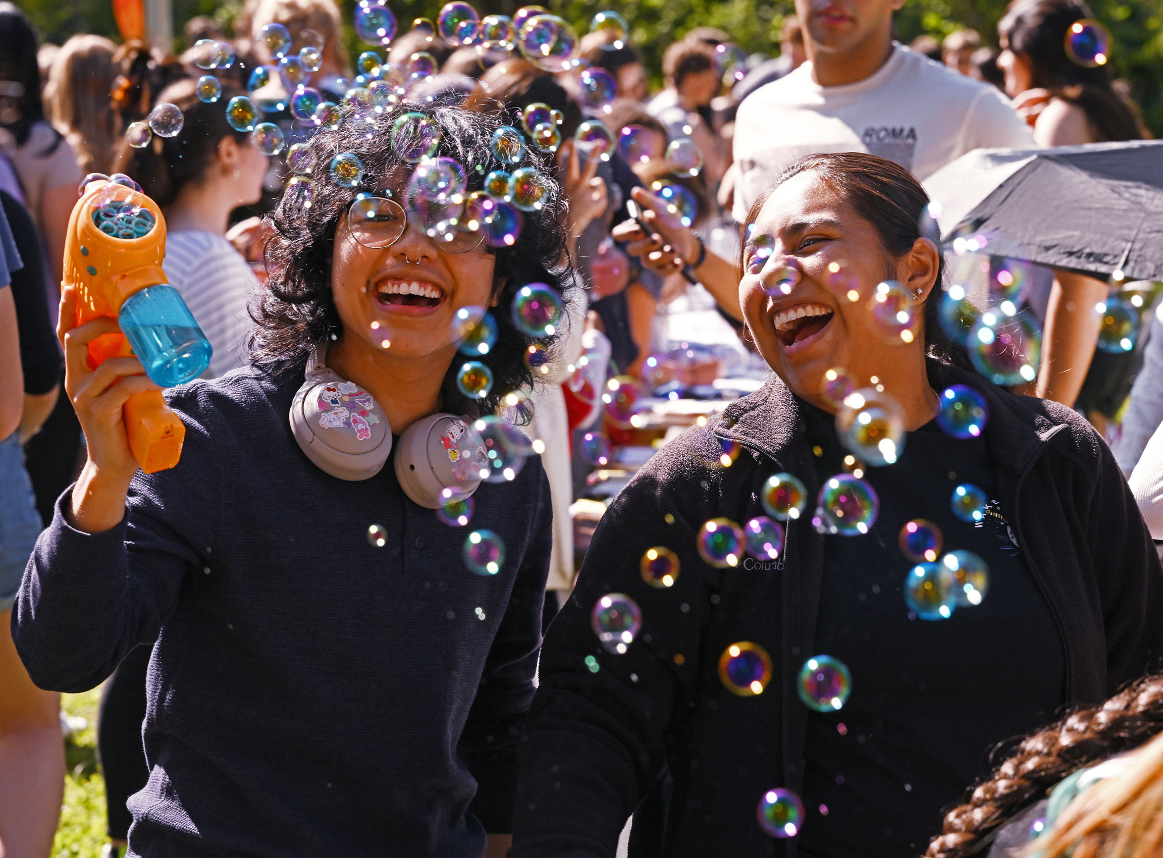 Students blow bubbles at the Fall carnival