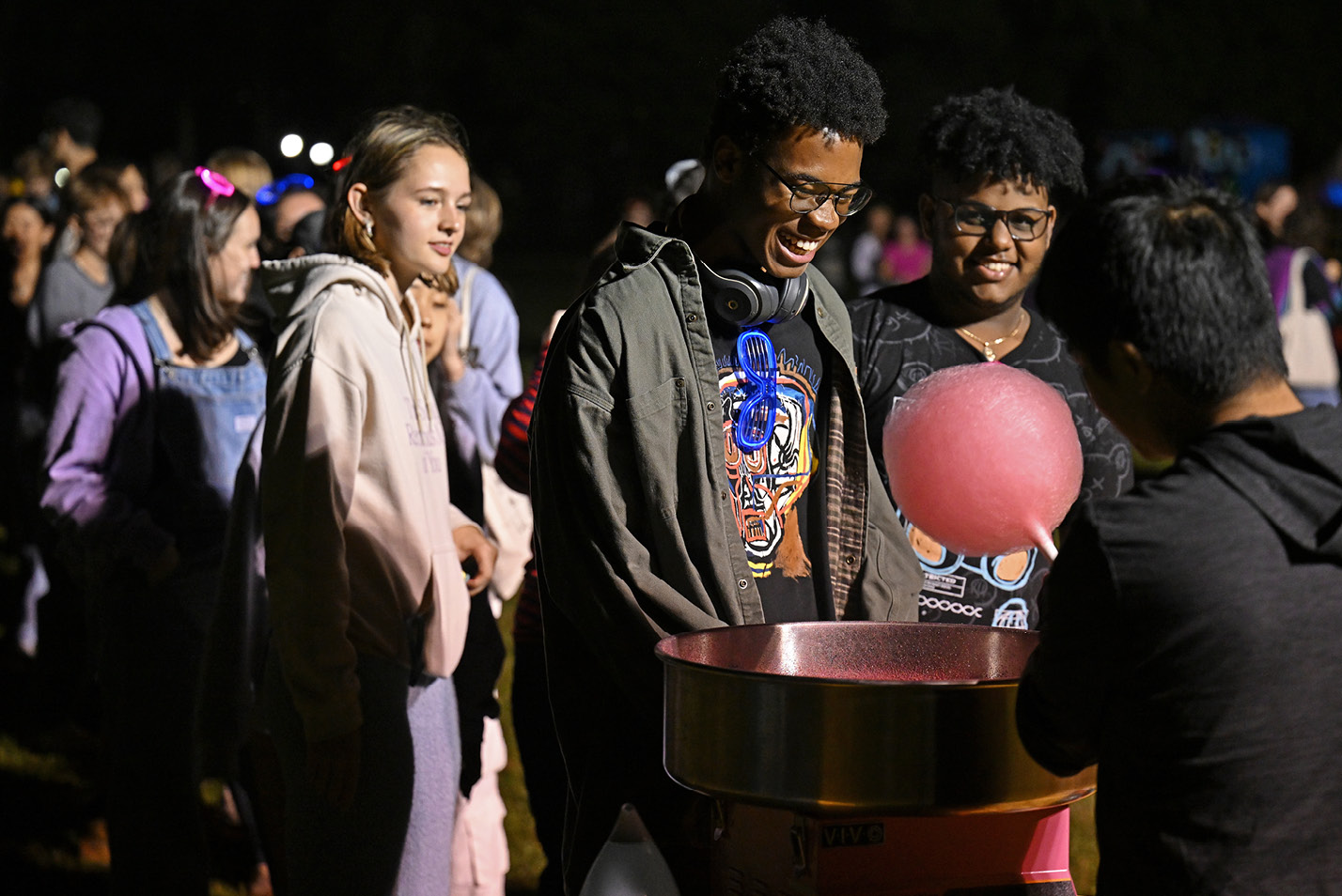 Students wait for cotton candy at the Fall carnival