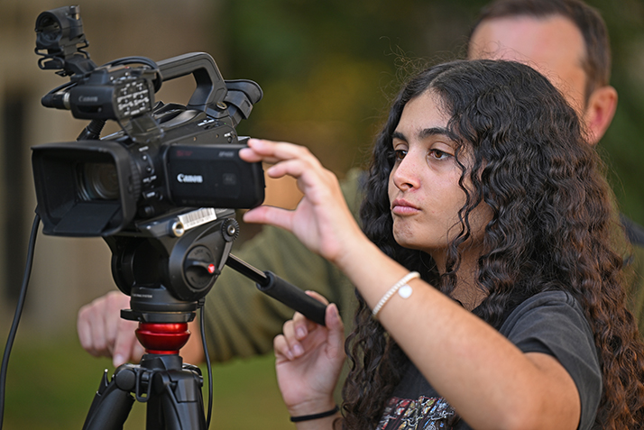 A student participates in a film studies course.