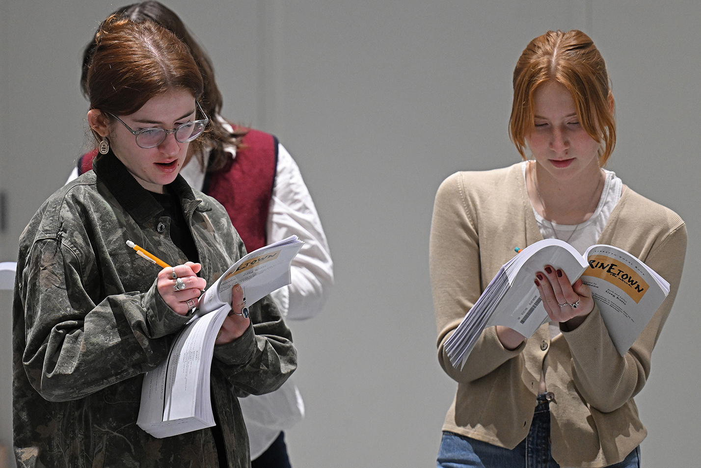 two actors make notations in script books