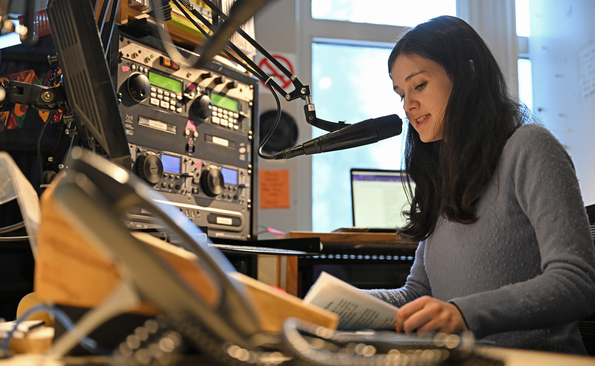 Riley Madden ’26 broadcasts her weekly radio show, “Pirate Radio” from the studios at WCNI.