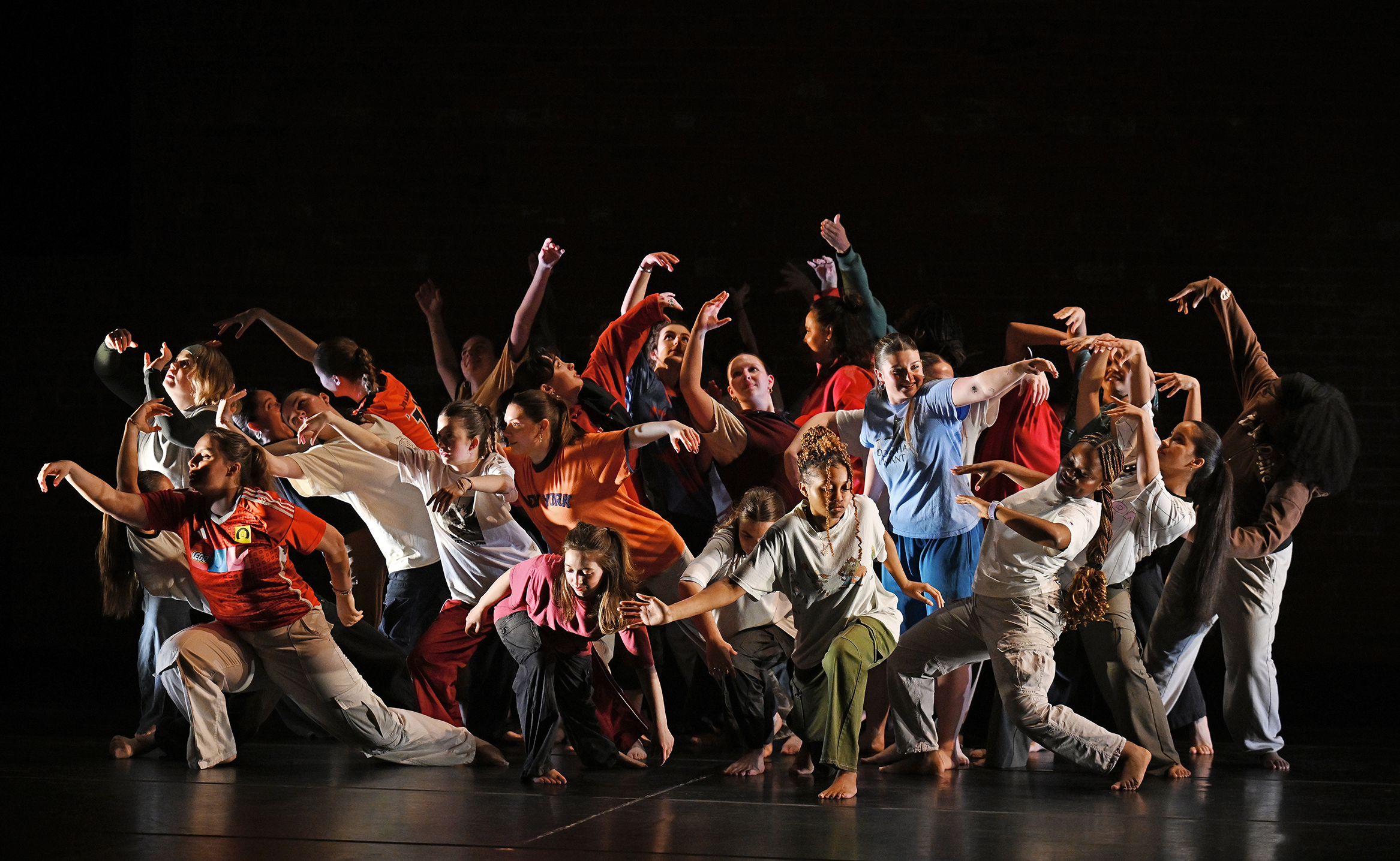Student dancers perform on stage.