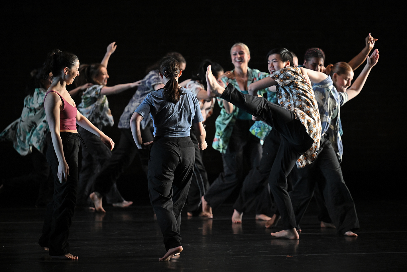 Dancers perform on stage.