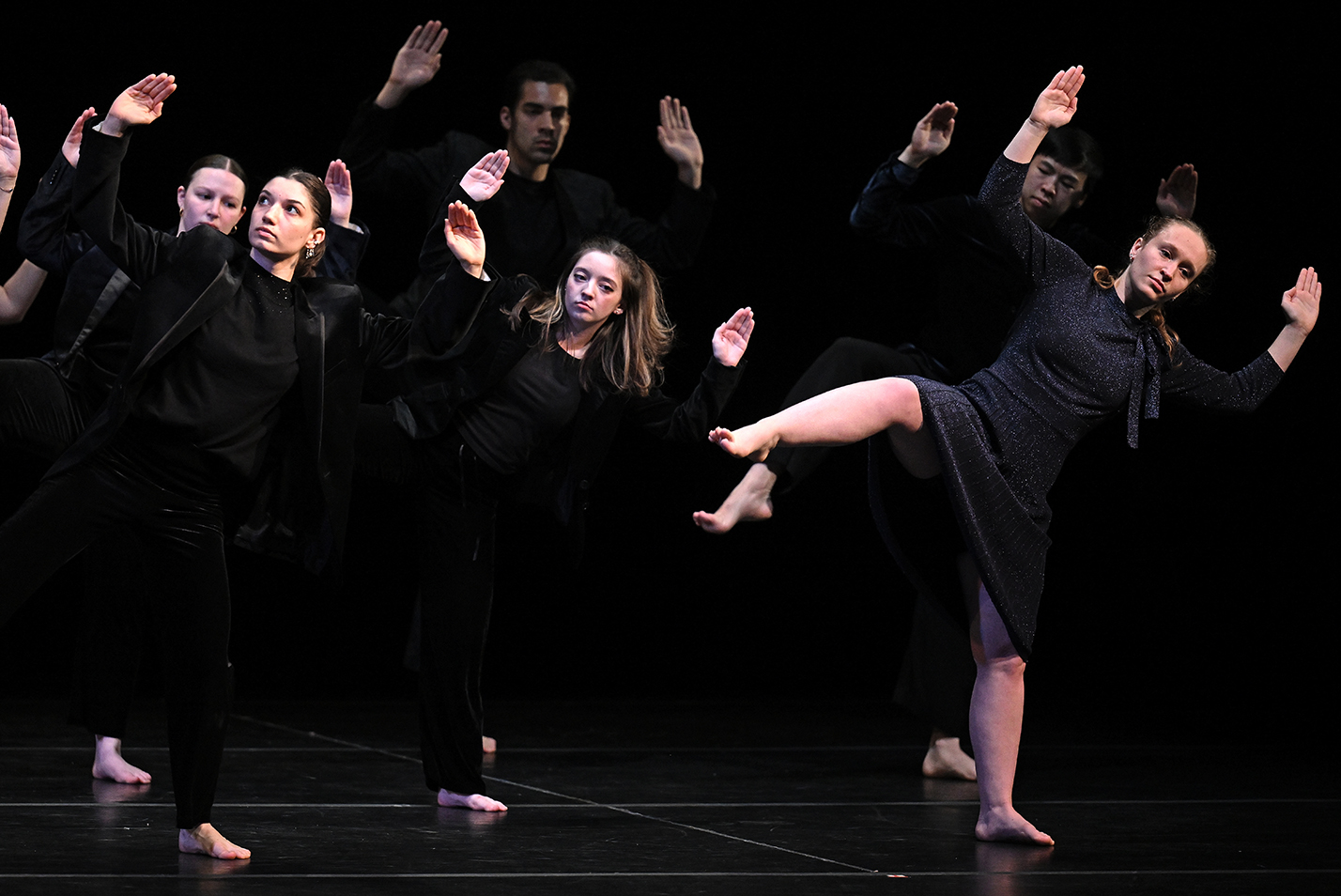 Dancers perform on stage.
