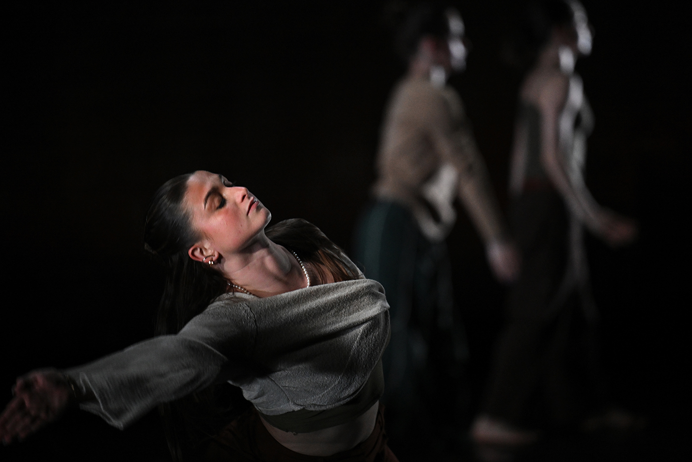 A solo dancer performs on stage.