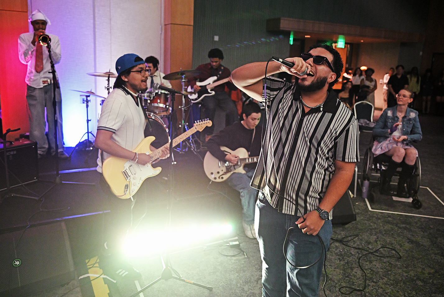A student band performs during intermission at a fashion show.