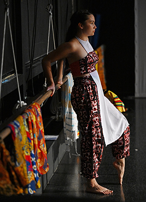 Catja stands just off stage during a performance at Connecticut College.