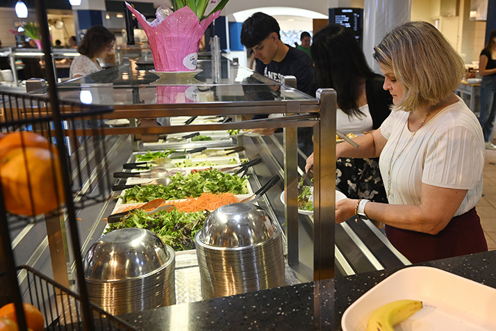 President Andrea Chapdelaine grabs lunch in Harris Refectory.