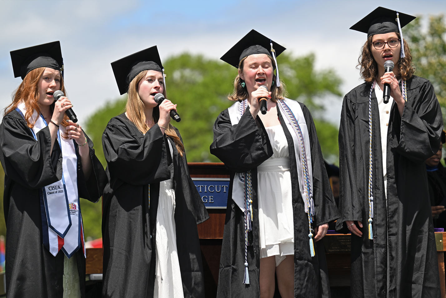 Katharine Anne Caviness ’25, Samantha Grace Lamontagne ’25, Jillian Rose Sheppard Pearson ’25 and Megan Elizabeth Spindler ’25 sang the “Alma Mater,” with musical accompaniment by the New London Little Band.