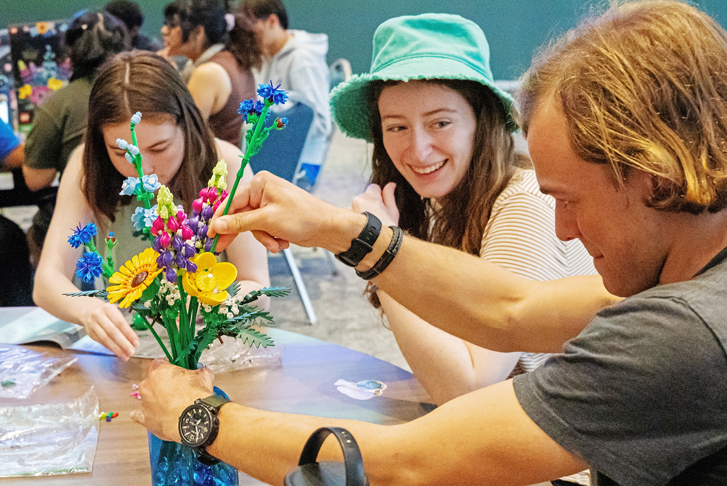Students prepare Lego flower centerpieces for a pre-Inauguration dinner