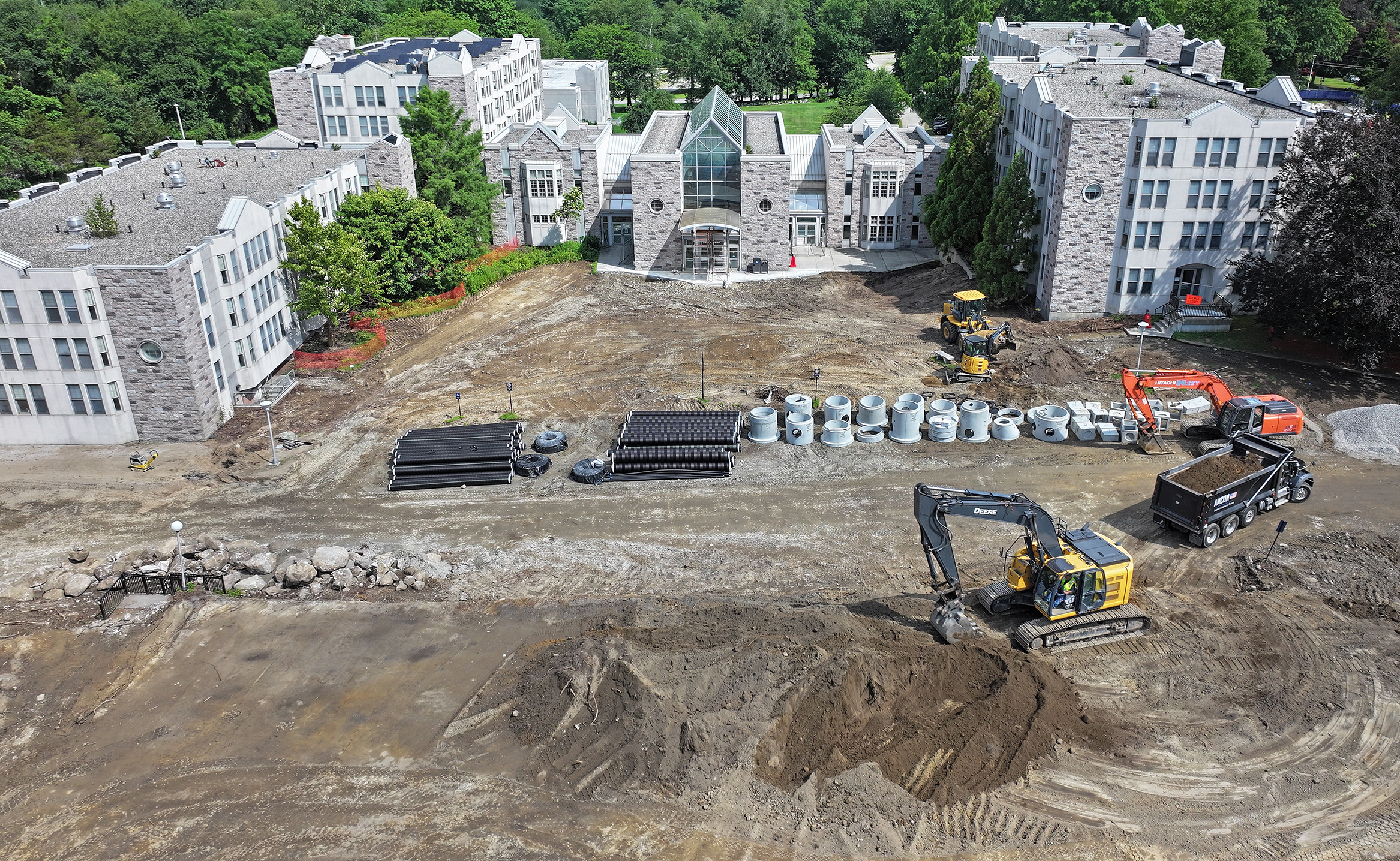 Heavy equipment works on a construction site.