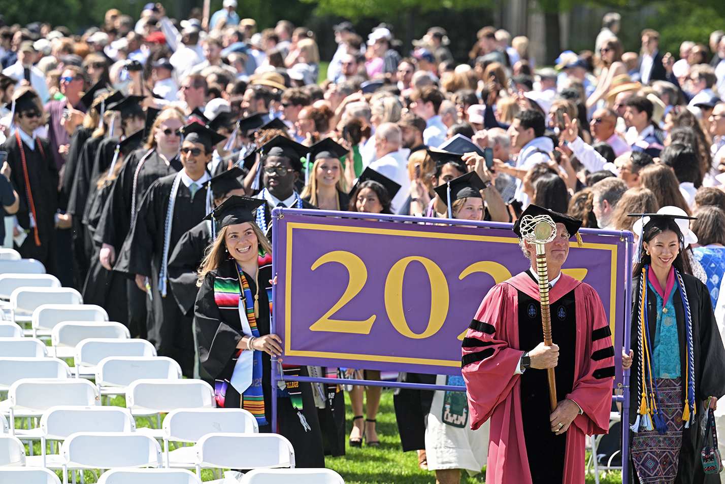 The class of 2025 processes toward the stage for their commencement exercises.