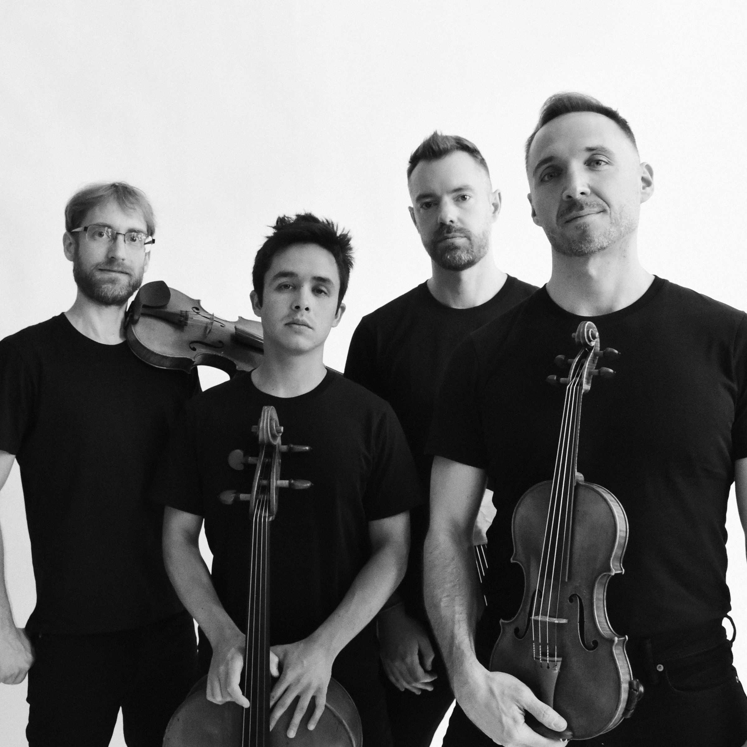 black and white photo of men with string instruments